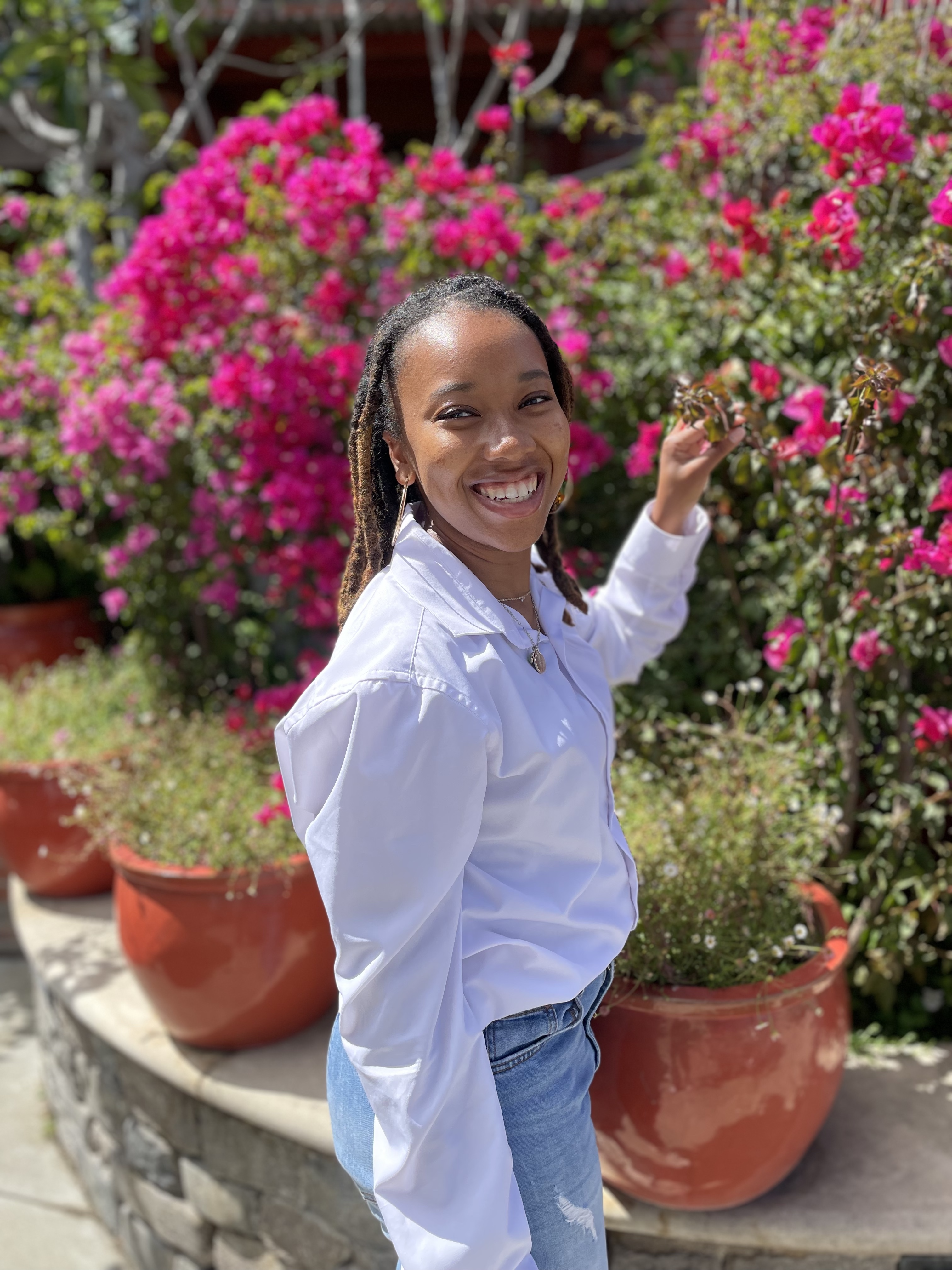 Image of Danielle holding pink flowers